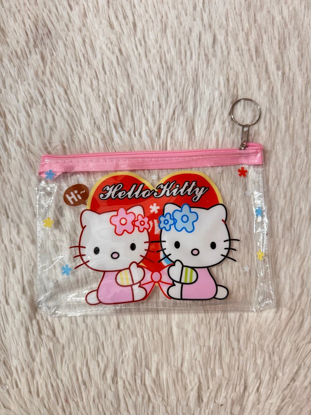 Hello Kitty clear pouch keychain with two Hello Kitty holding hands